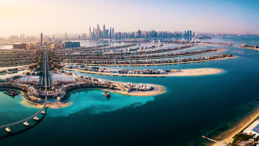 Aerial view of UAE coastline with Free Zones, illustrating cost comparisons for business licenses.